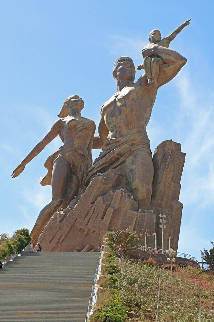 A statue of a person and person
AI-generated content may be incorrect.