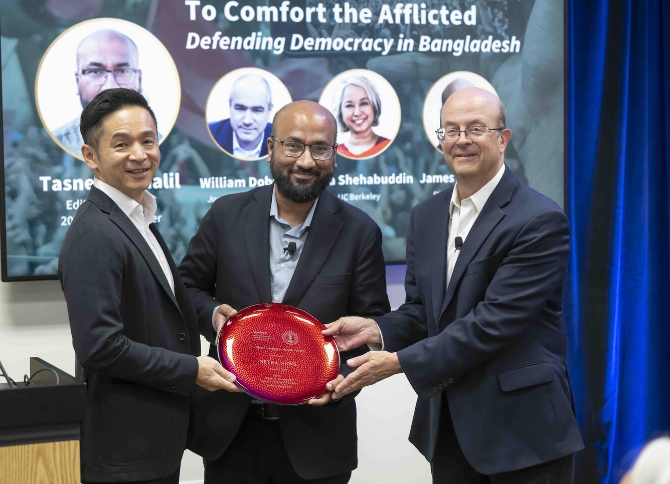 A group of men holding a red object

AI-generated content may be incorrect.