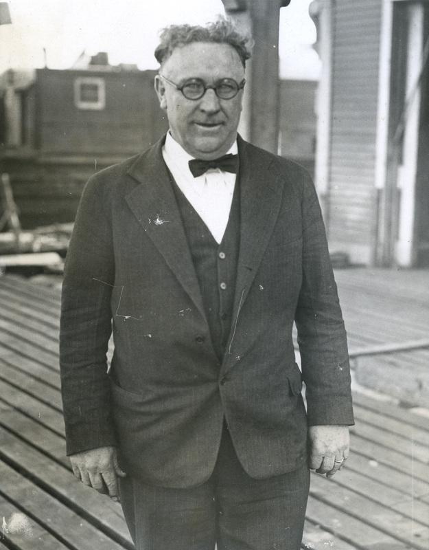 A person in a suit and bow tie
AI-generated content may be incorrect.