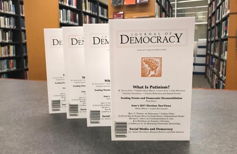 A row of white books on a table

AI-generated content may be incorrect.