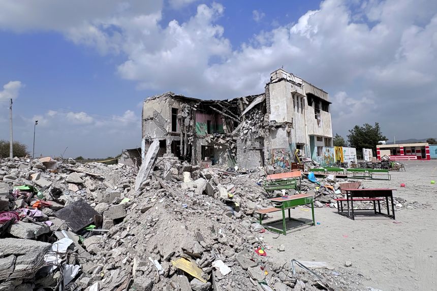 At least 168 children and 14 adults died in the attack, according to Iranian state media.