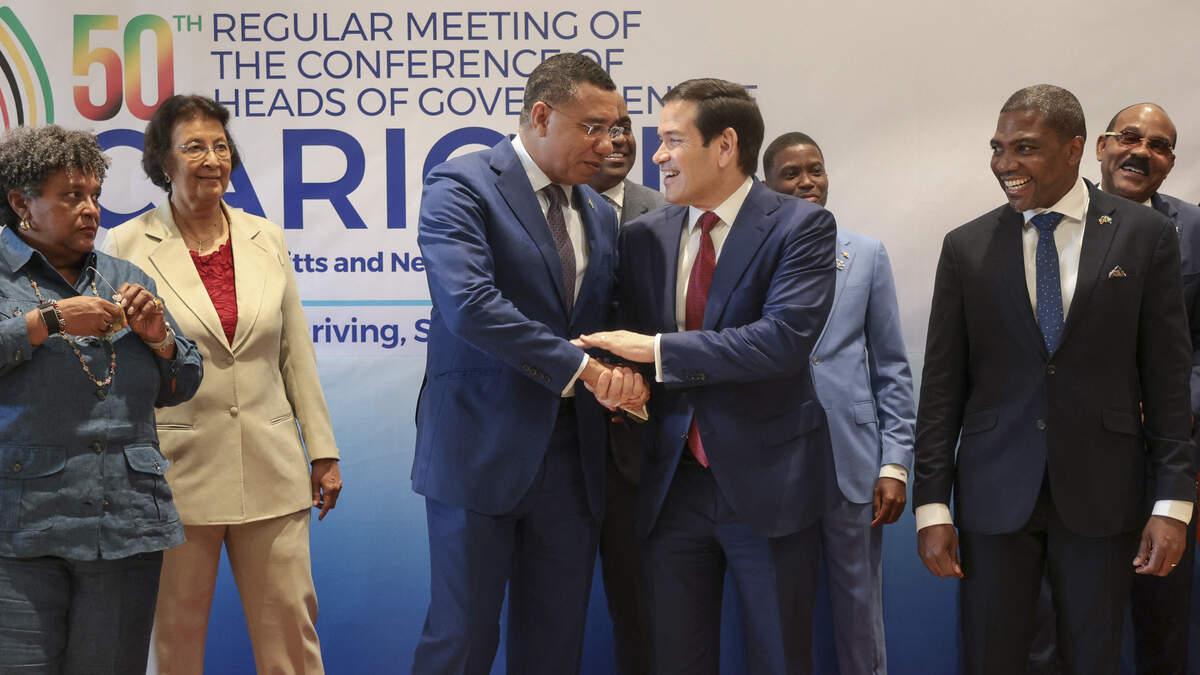 US Secretary of State Marco Rubio shakes hands with Jamaica's Prime Minister Andrew Holness during a family photo with Caribbean Community (CARICOM) heads of government in Basseterre, Saint Kitts and Nevis, February 25, 2026. Rubio is meeting with Caribbean leaders seeking a common line on Venezuela and pressure on Cuba. He's also addressing President Donald Trump's priorities, including combating illegal immigration, drug trafficking and regional security. (Photo by Jonathan Ernst / POOL / AFP via Getty Images)