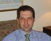 A person in a blue shirt and tie

AI-generated content may be incorrect.