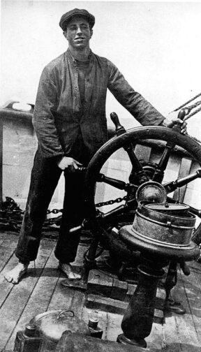 A person standing next to a steering wheel

AI-generated content may be incorrect.