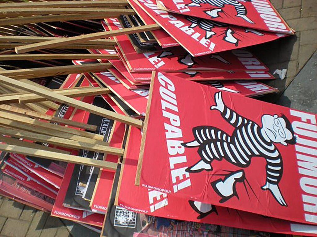 “Fujimori Guilty!” signs stacked in preparation for a human right march called to support a guilty verdict, right before Fujmori’s April 2009 sentencing