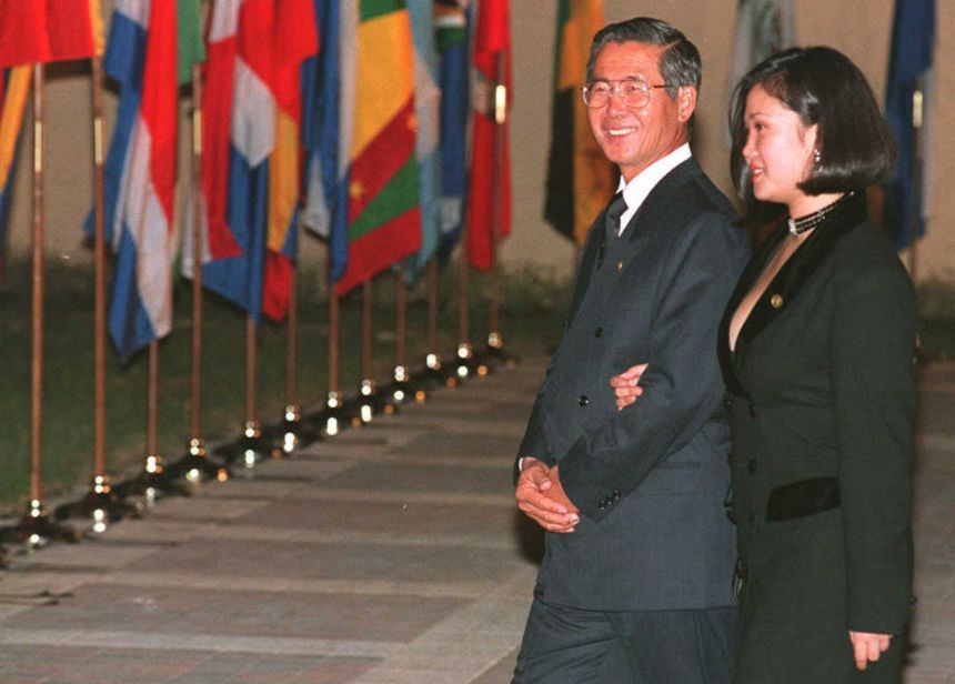Peruvian President Alberto Fujimori (left) and his daughter Keiko Fujimori arrive at the Biltmore Hotel in Coral Gables, Florida, for a private dinner hosted by US President Bill Clinton on December 9, 1994.
