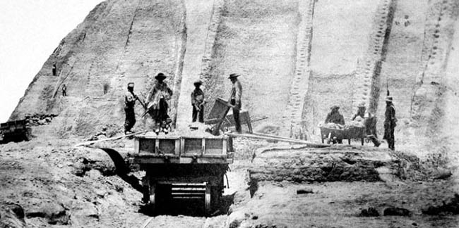 A group of men working in a quarry

Description automatically generated