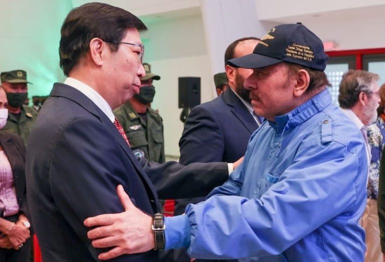 A person in a suit shaking hands with a person in a blue shirt

AI-generated content may be incorrect.