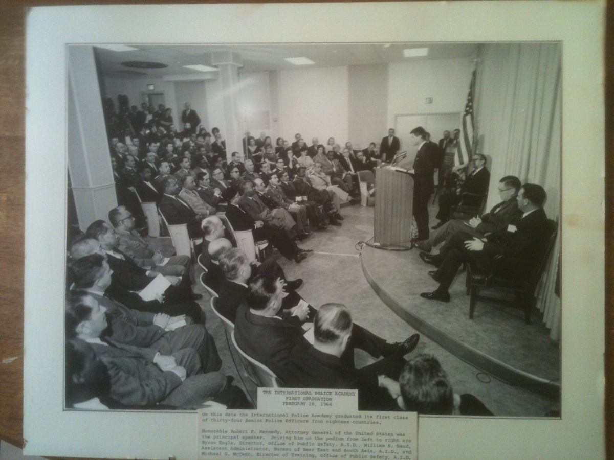 A person standing on a podium giving a speech to a group of people

AI-generated content may be incorrect.
