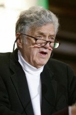 A person wearing glasses and a black jacket

AI-generated content may be incorrect.