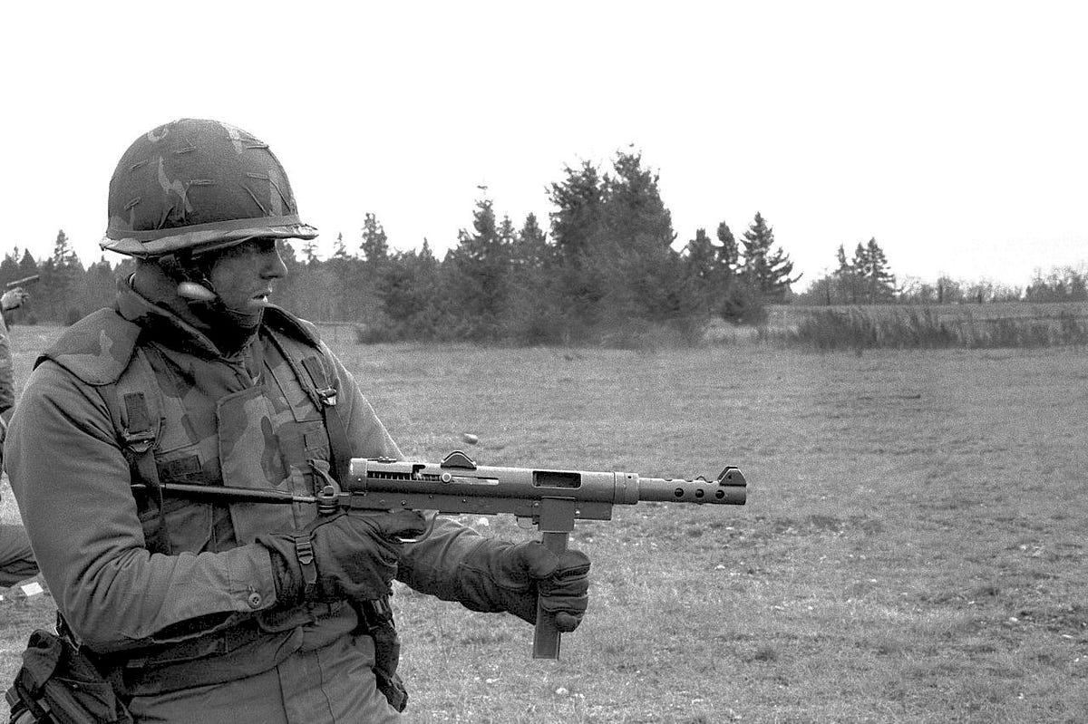 A soldier holding an object

AI-generated content may be incorrect.